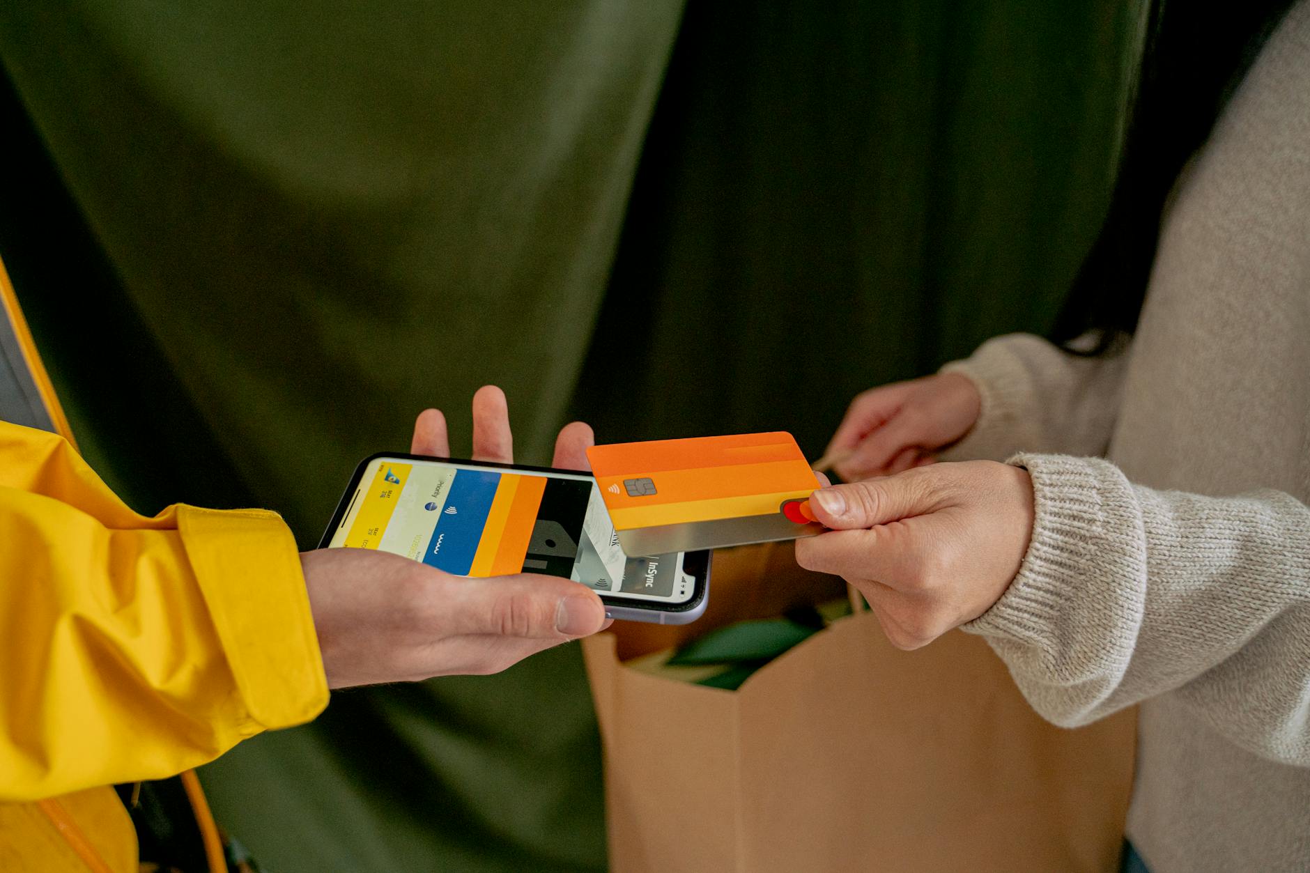 Person using smartphone for contactless digital wallet payment