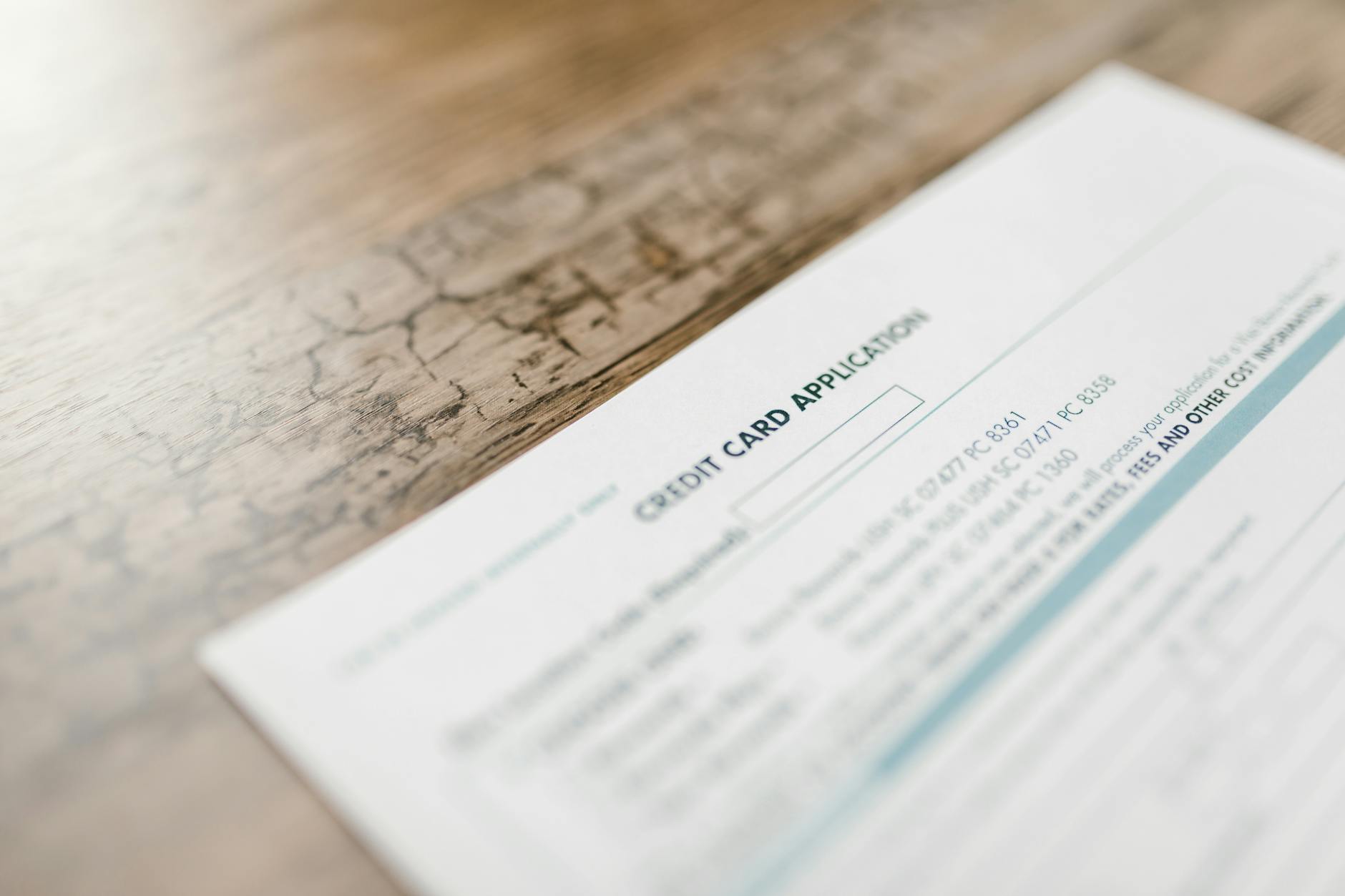 A person reviewing bank account paperwork at a desk