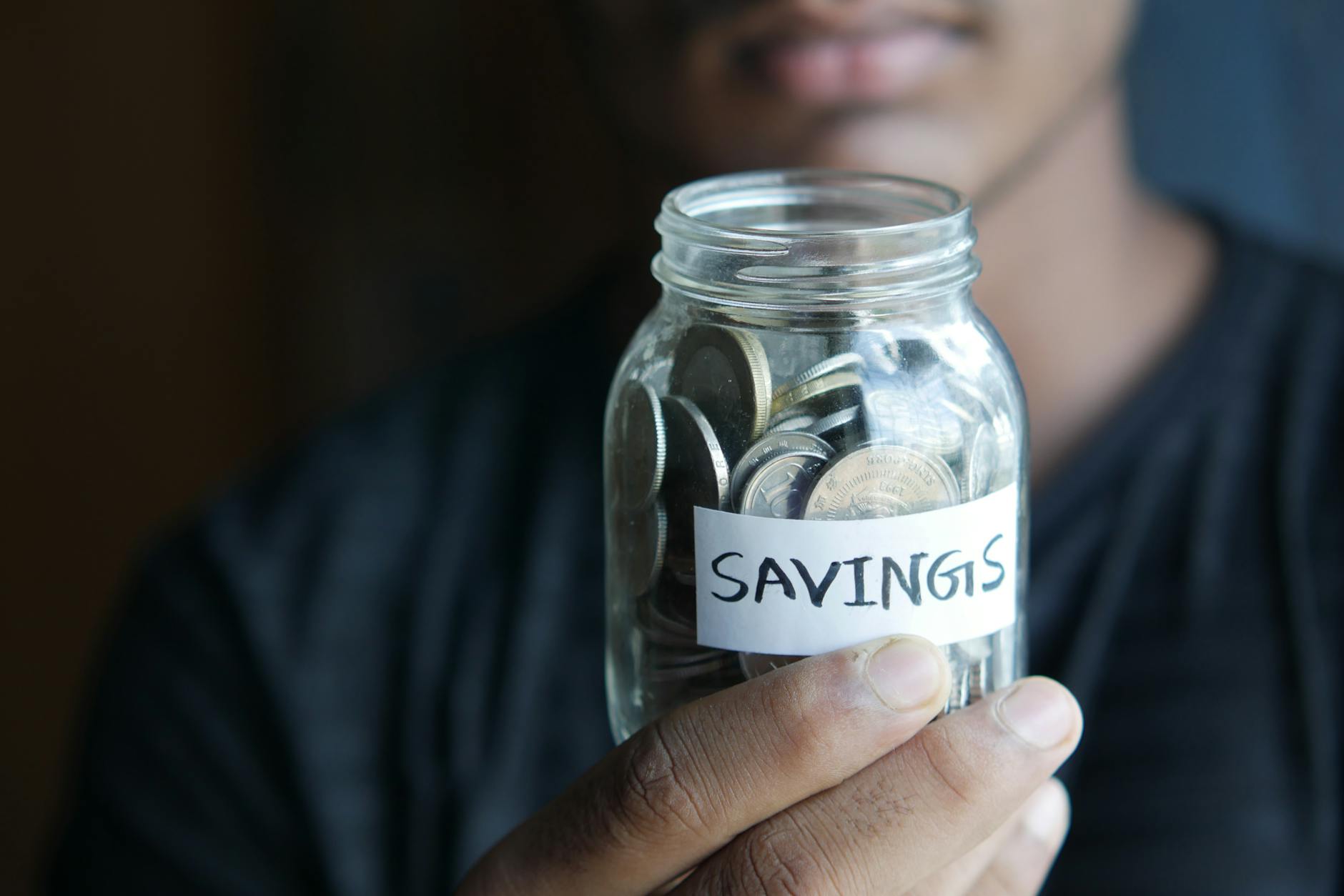Savings jars labeled for specific goals — a sinking funds strategy