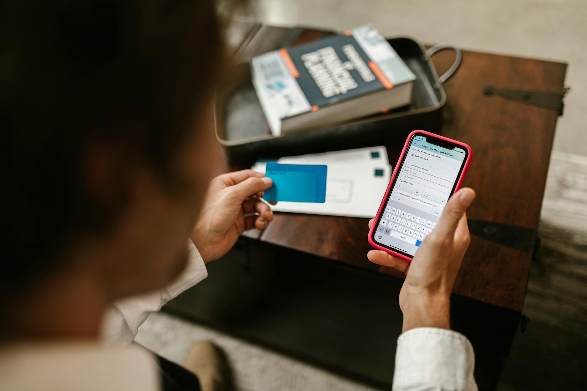 Person checking a banking app on a smartphone to view a direct deposit paycheck