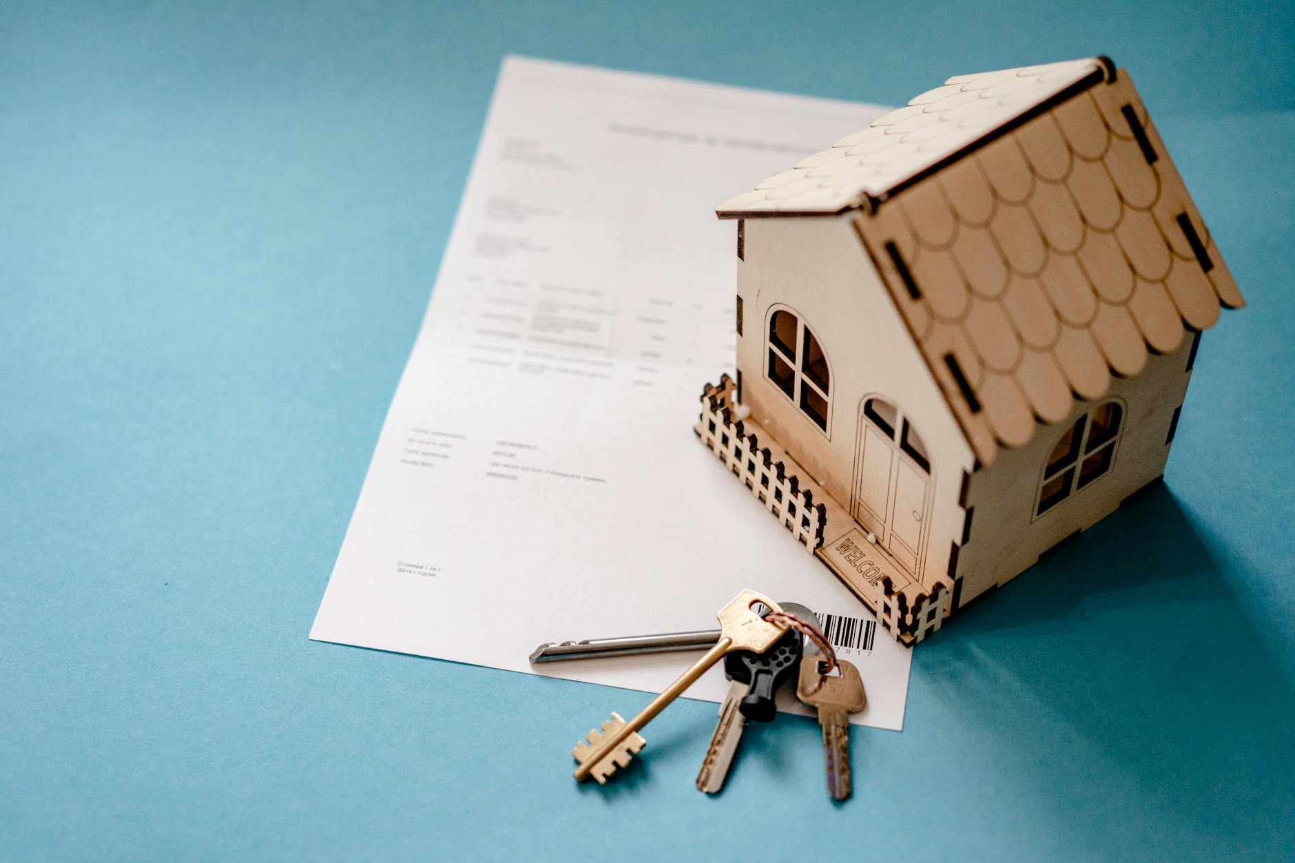 House keys resting on home loan and mortgage paperwork, illustrating borrowing against home equity with a HELOC or home equity loan