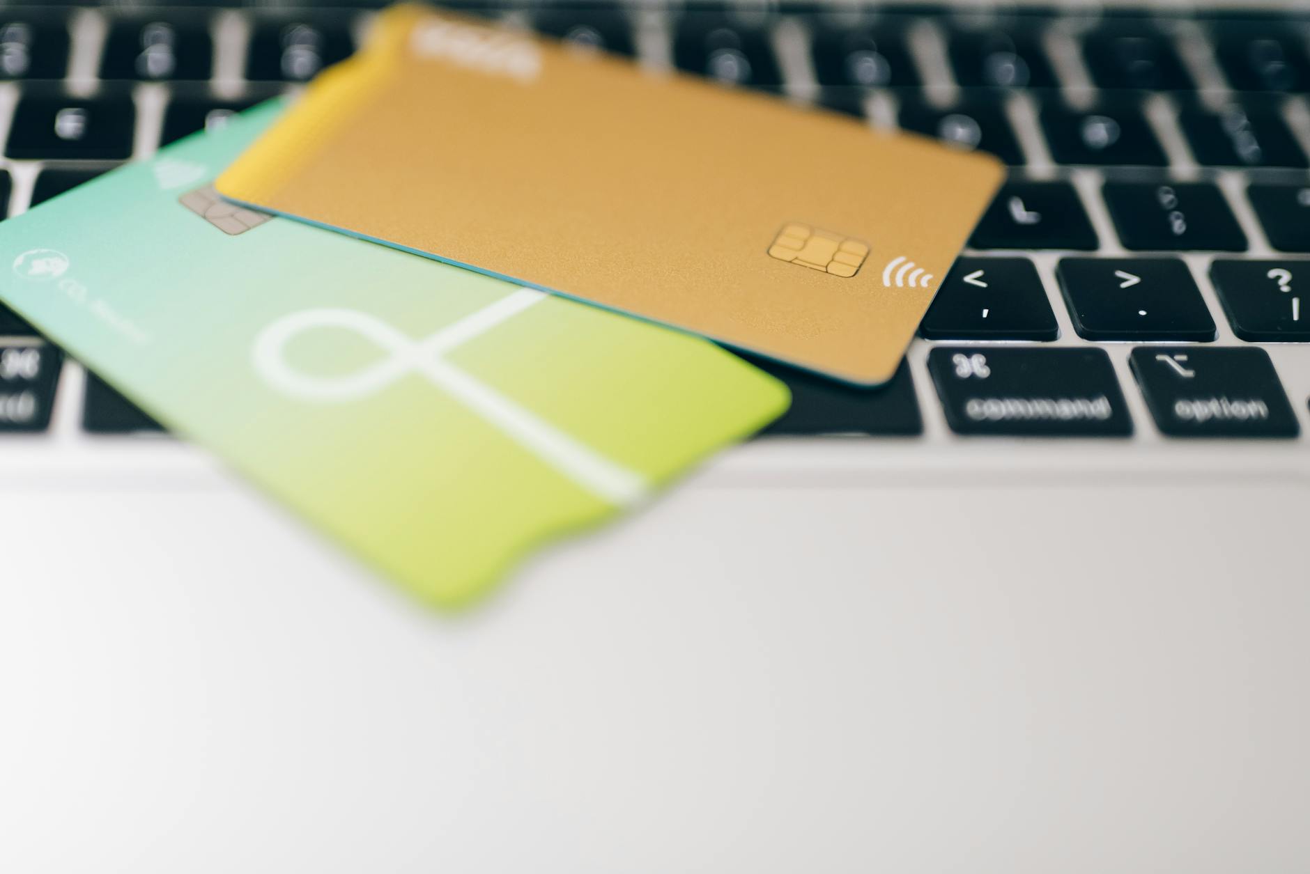 Person reviewing a credit card balance and credit score on a laptop, illustrating how credit utilization is calculated