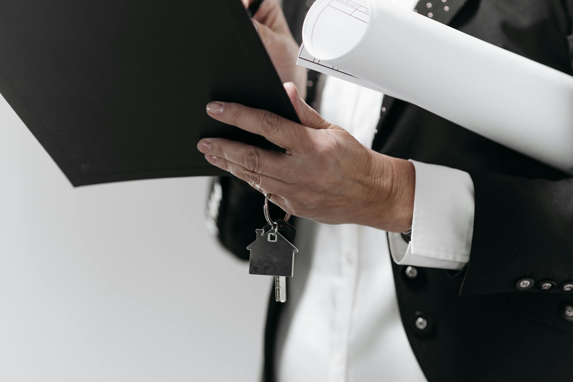House keys sitting on mortgage closing documents and loan estimate paperwork, illustrating the decision to buy discount points to lower a 2026 mortgage rate