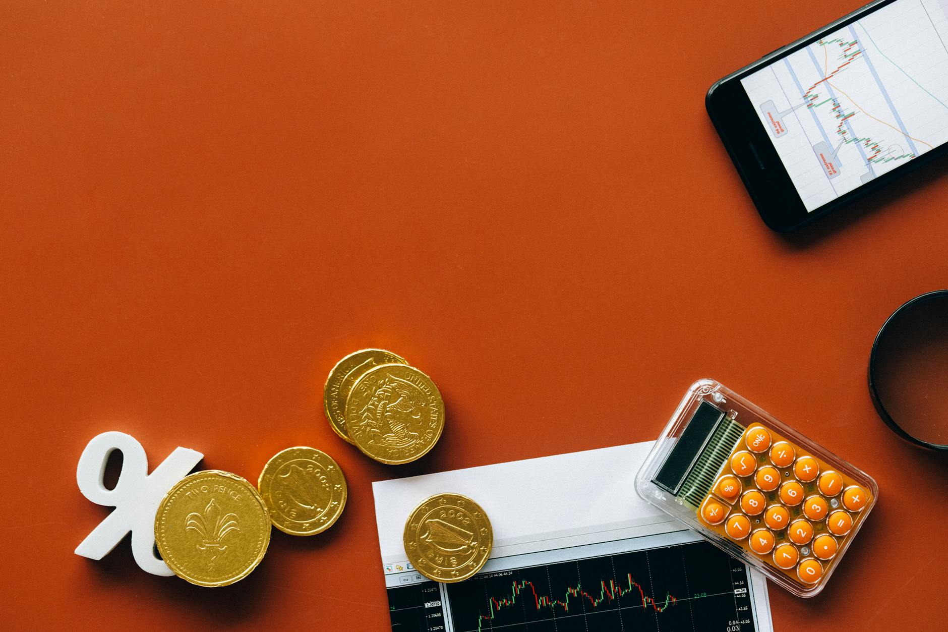 Calculator and financial growth chart showing compound interest