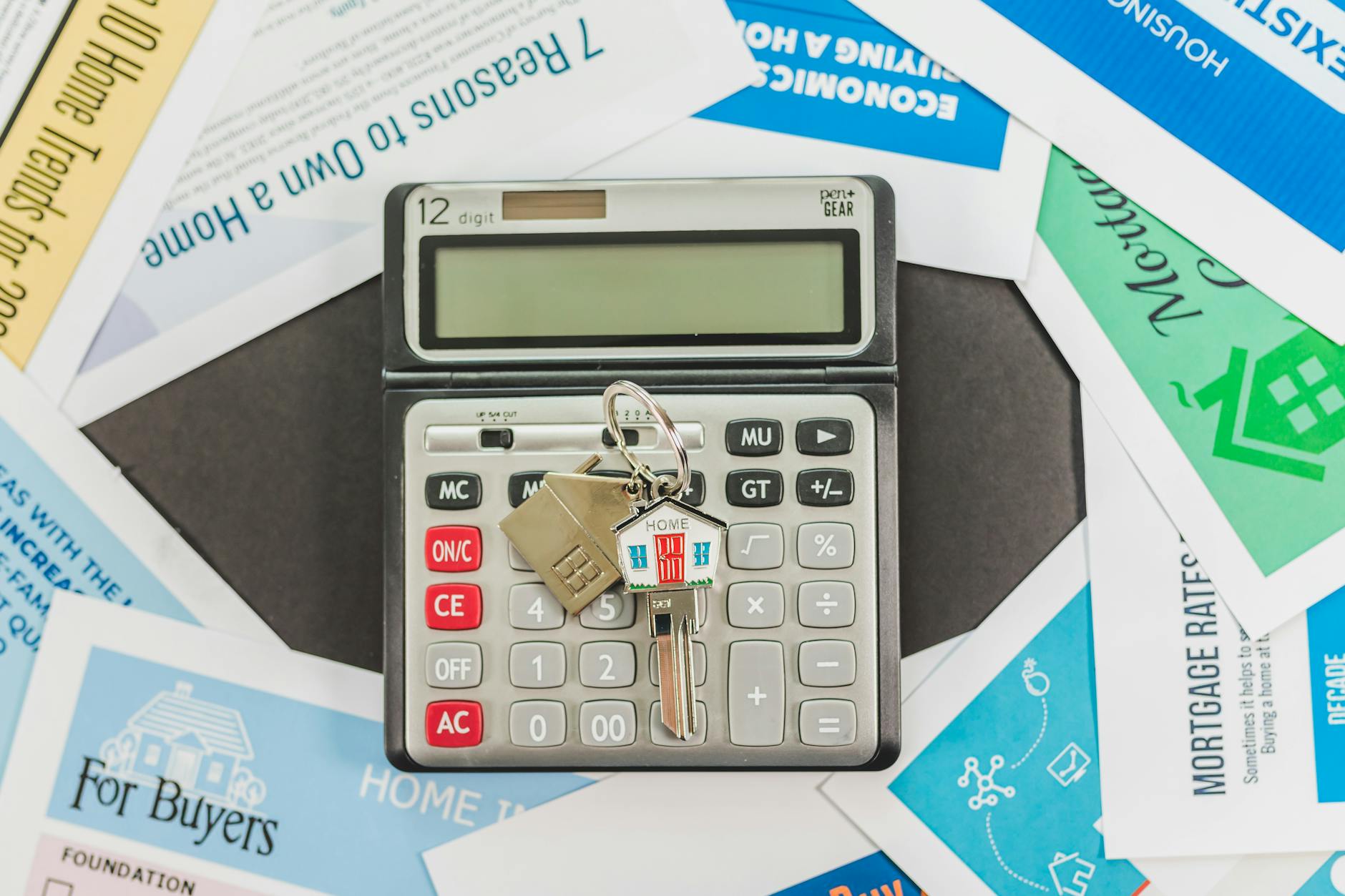 House keys on top of a mortgage document representing a homeowner's escrow account