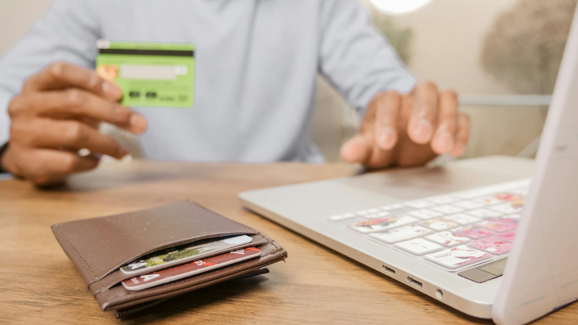 A credit card resting on a wallet, representing building credit