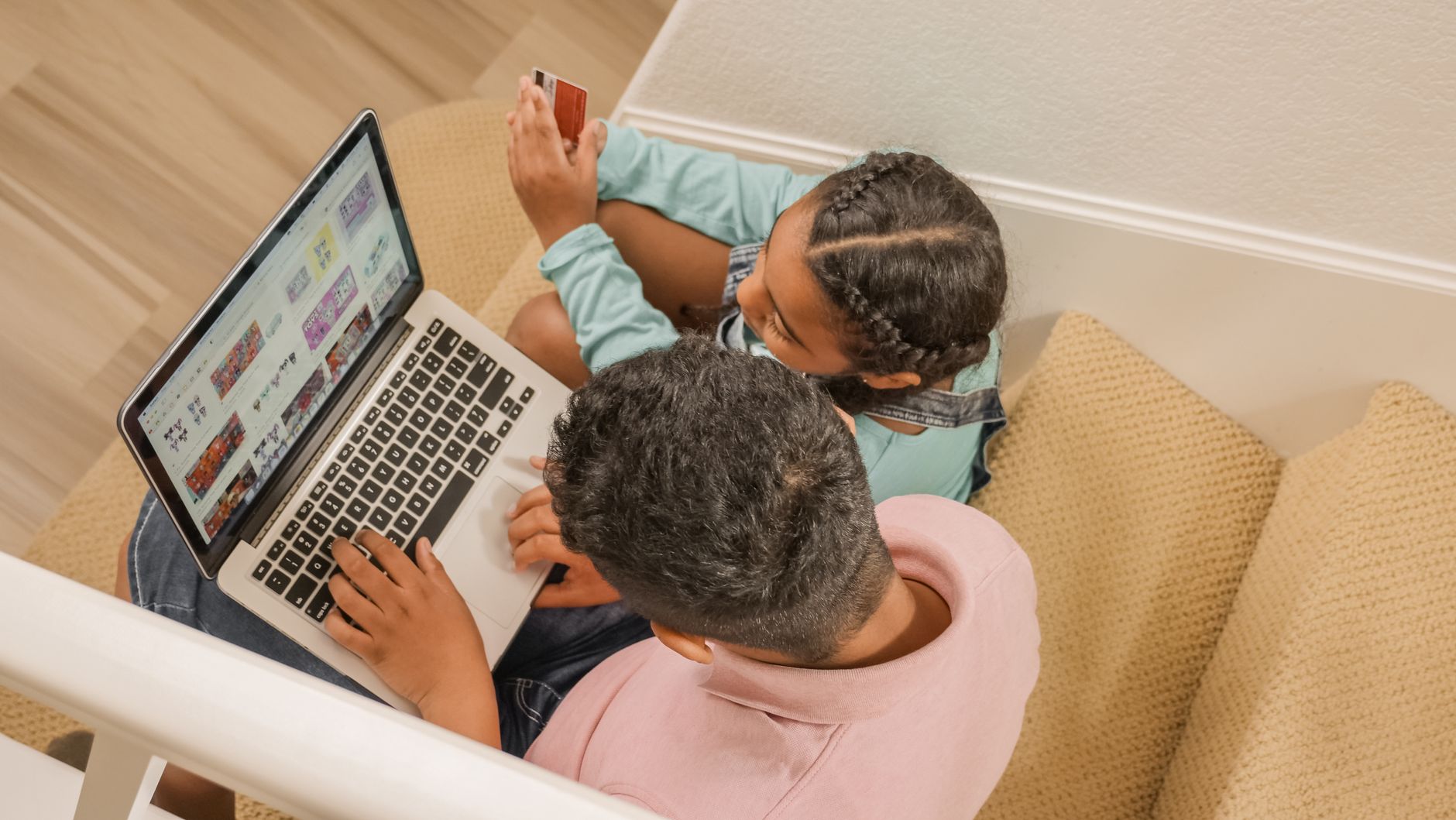 Two people reviewing a shared credit card account together