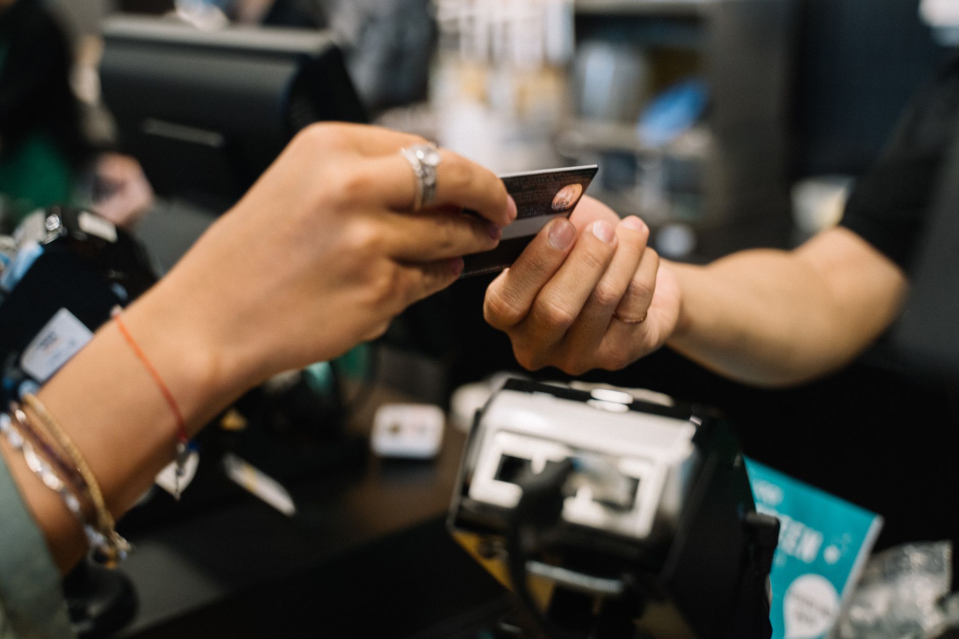 Customer paying with a credit card at a store checkout