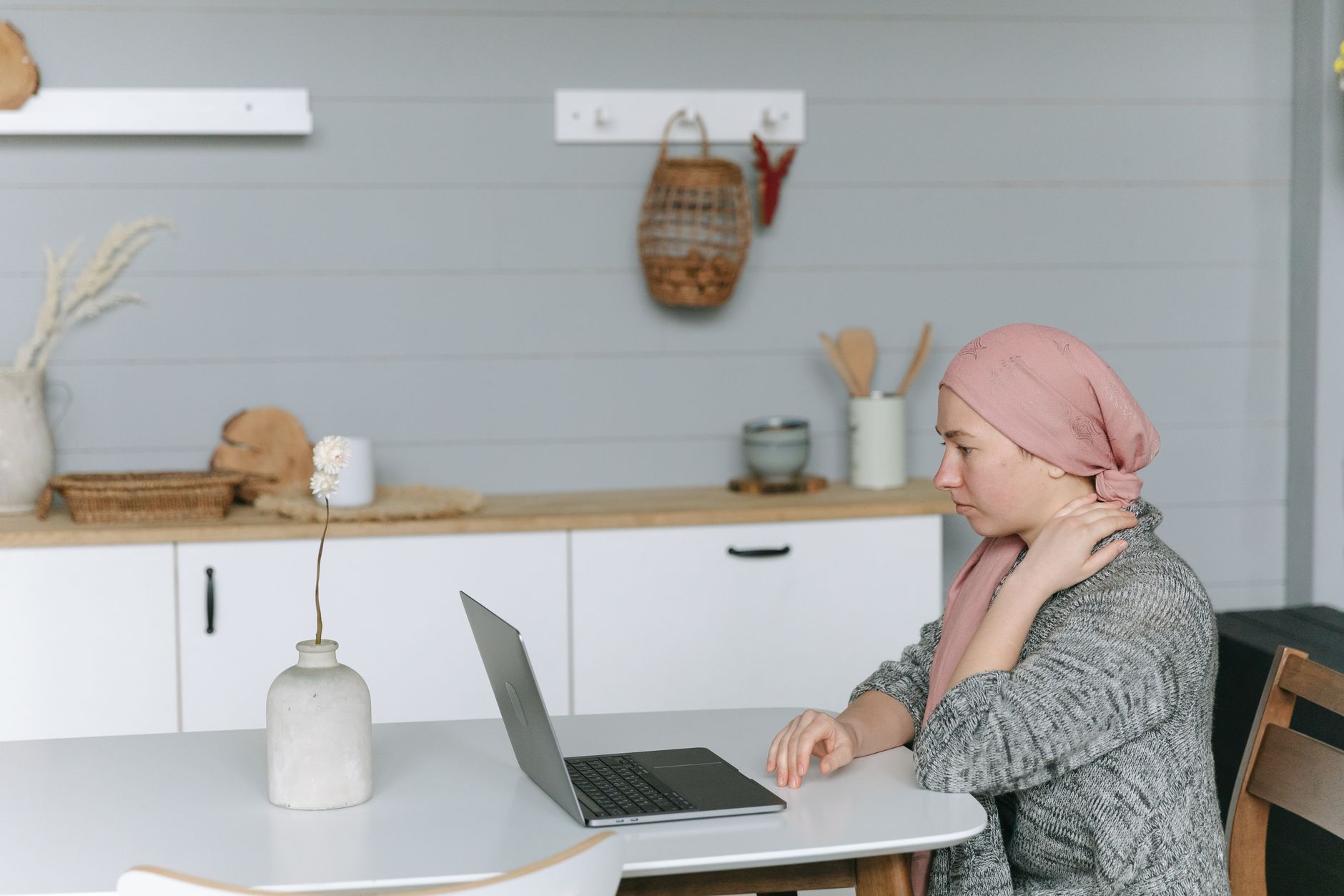 A person managing finances while recovering at home, illustrating how disability insurance protects income