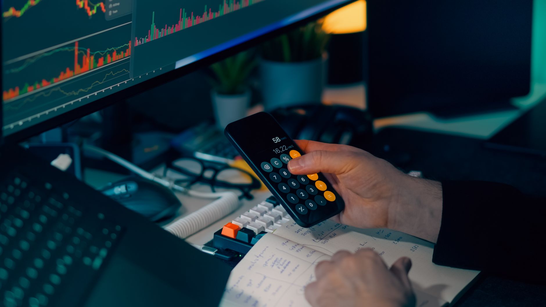 An investment growth chart and calculator on a desk, illustrating how a fund expense ratio works and affects returns