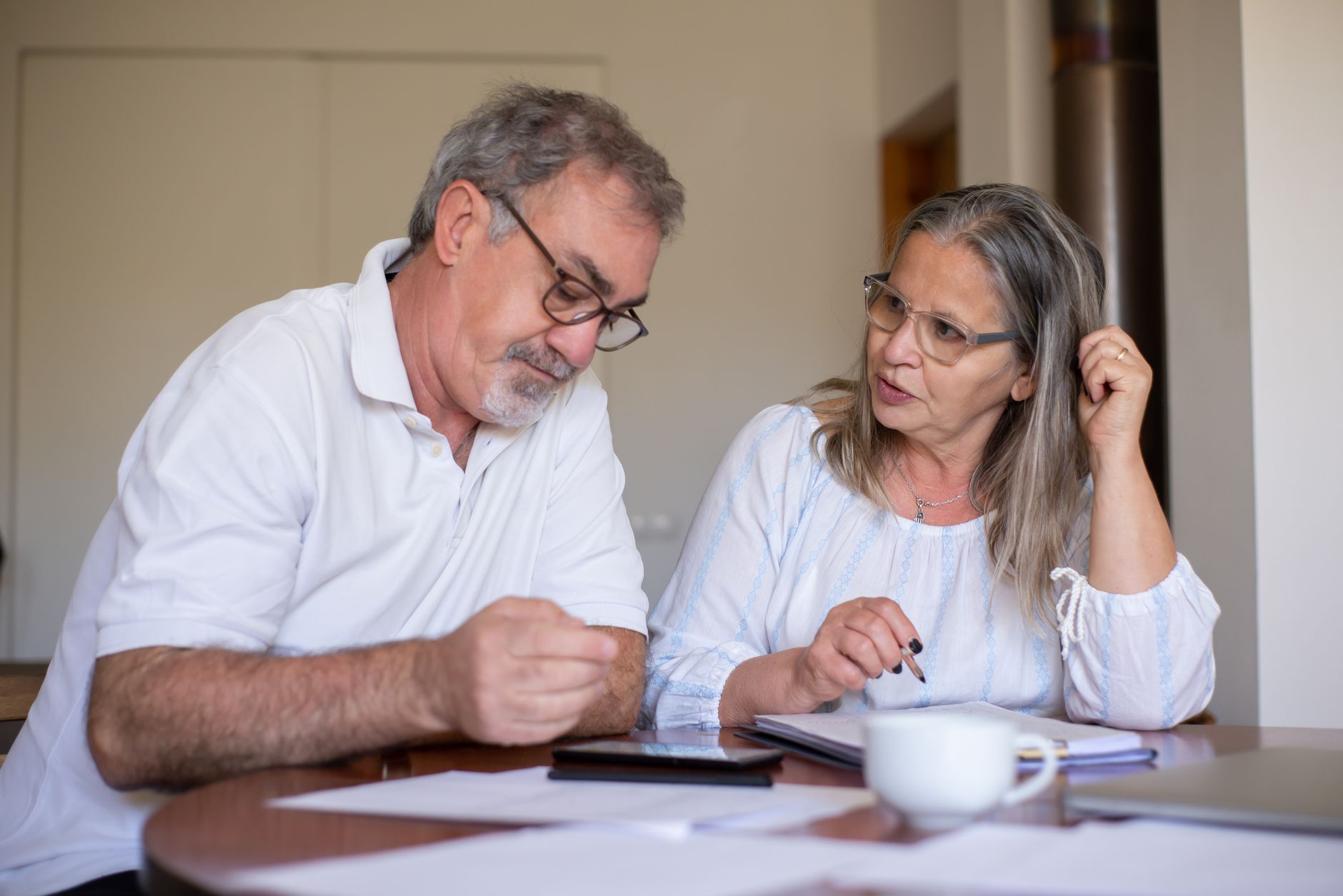 An older couple reviewing retirement finances, illustrating how annuities work in 2026
