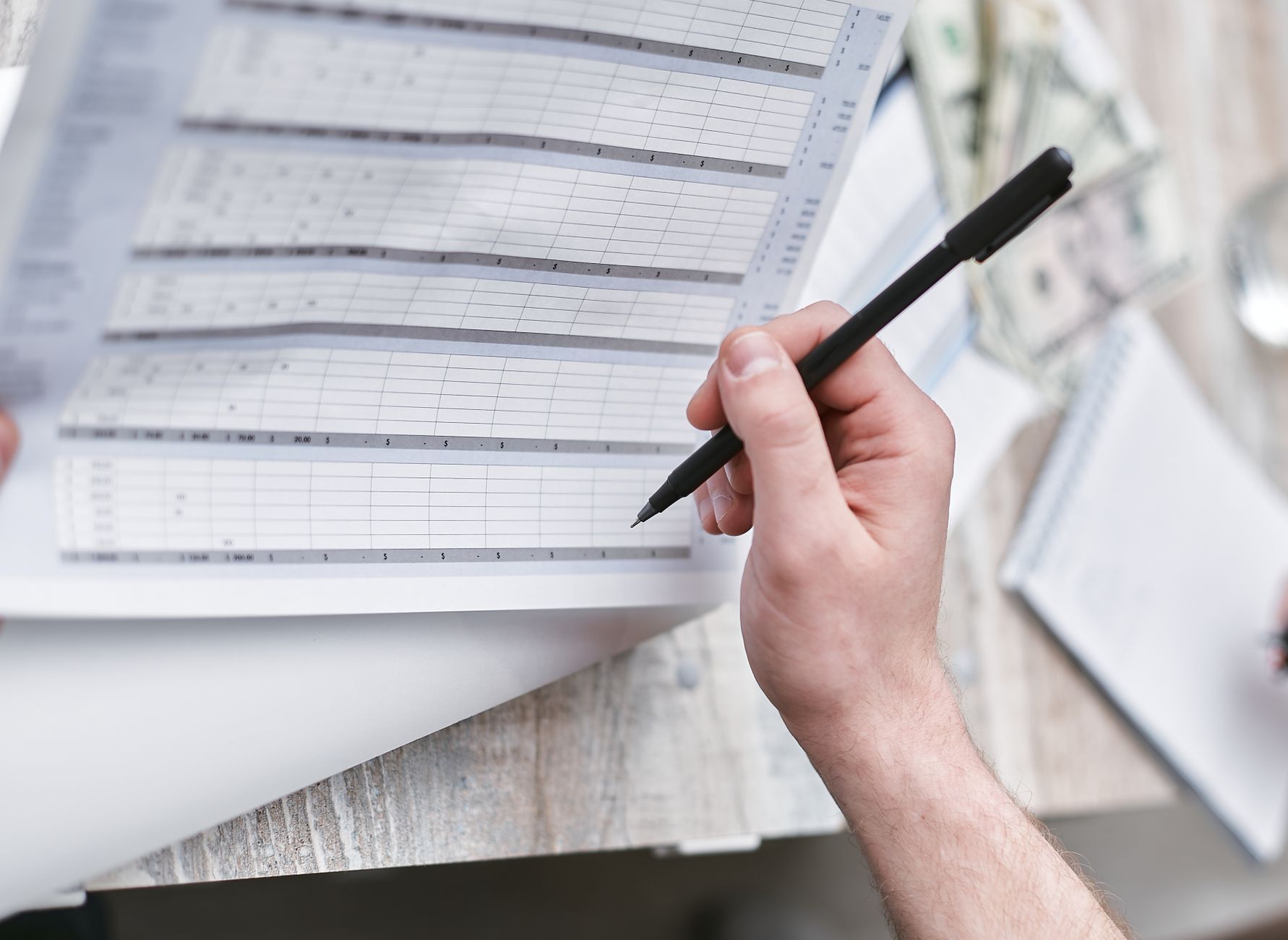 Investment statements and charts used to review mutual fund capital gains distributions
