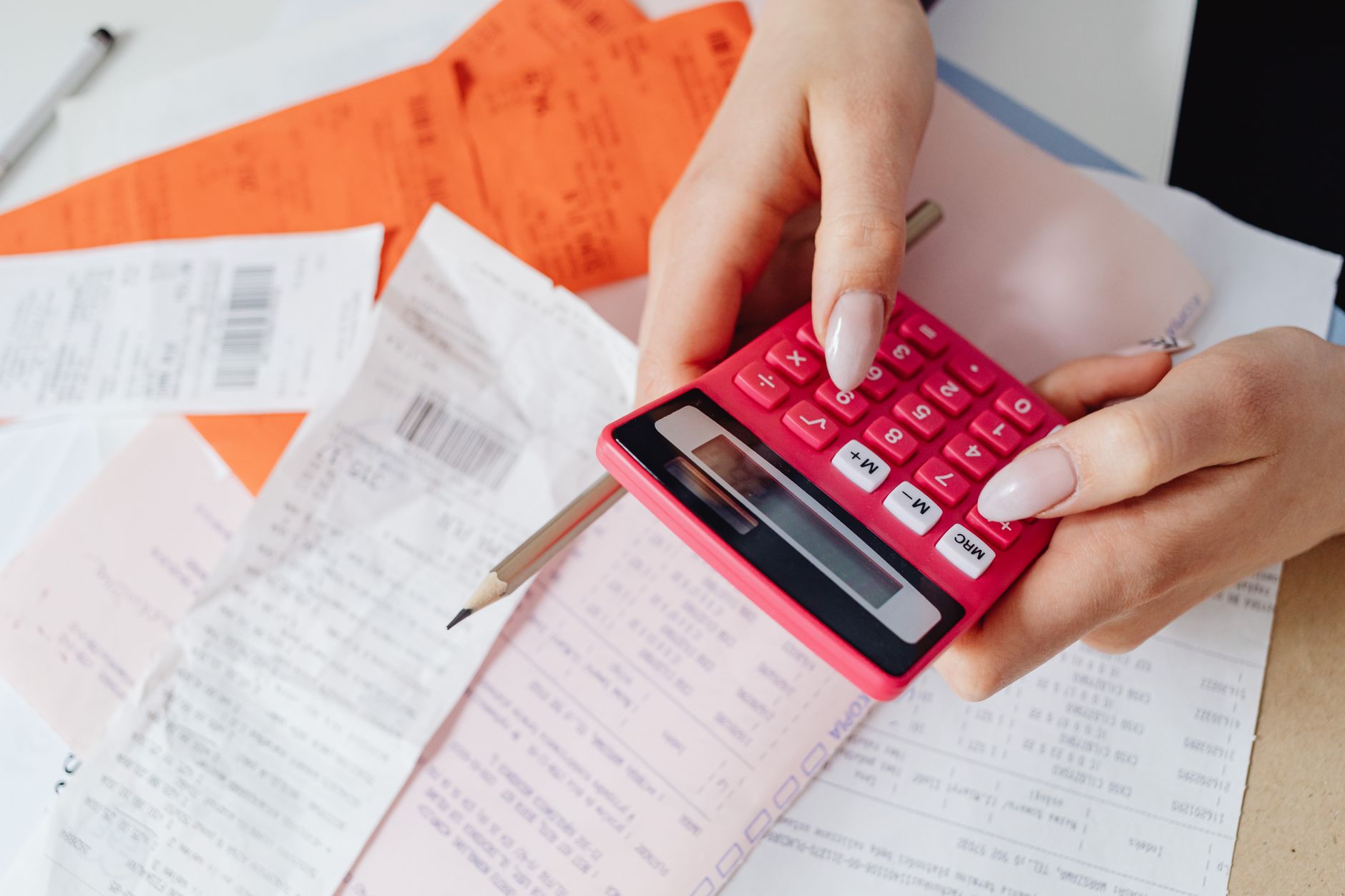 Health insurance paperwork and a medical bill on a table representing deductibles and out-of-pocket maximums