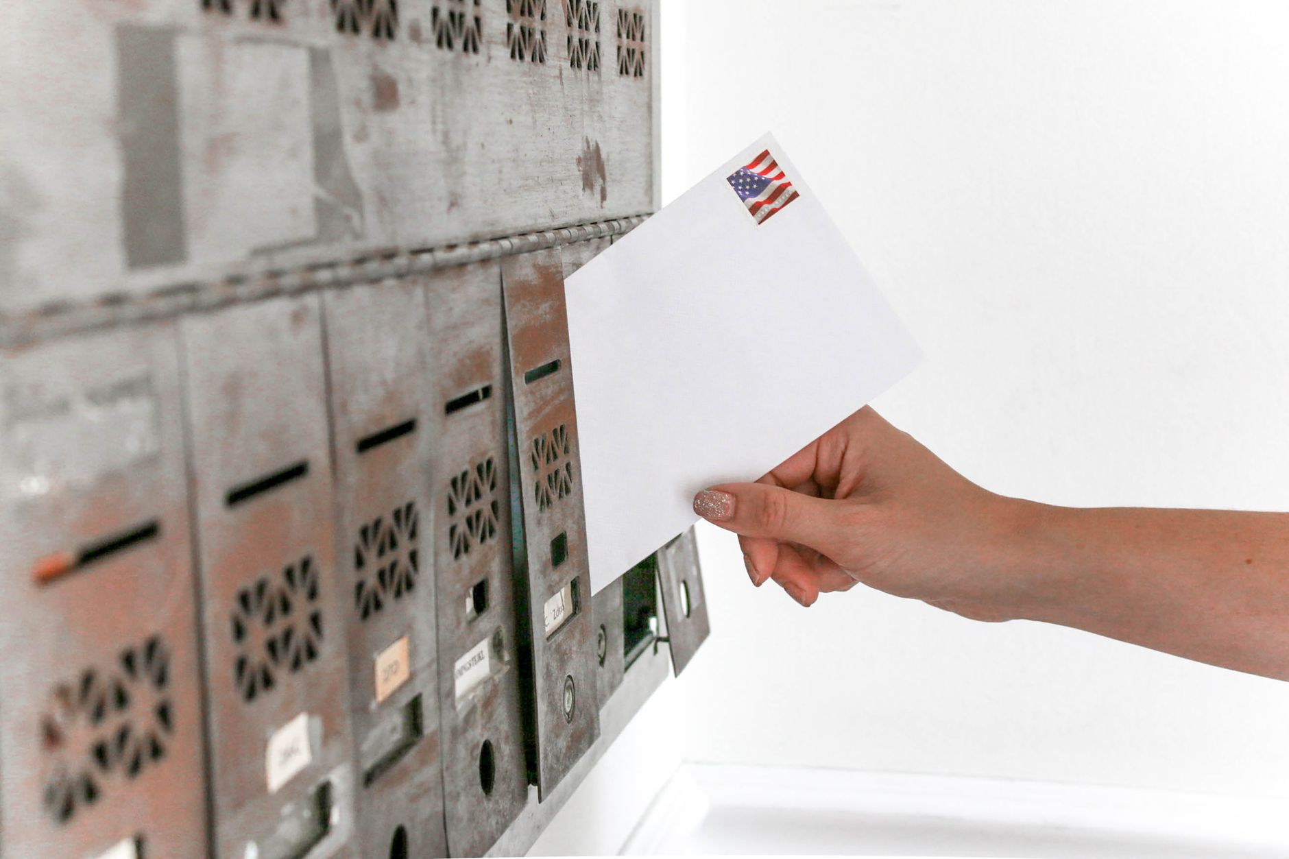 Envelopes stacked in a residential mailbox, representing prescreened credit offers