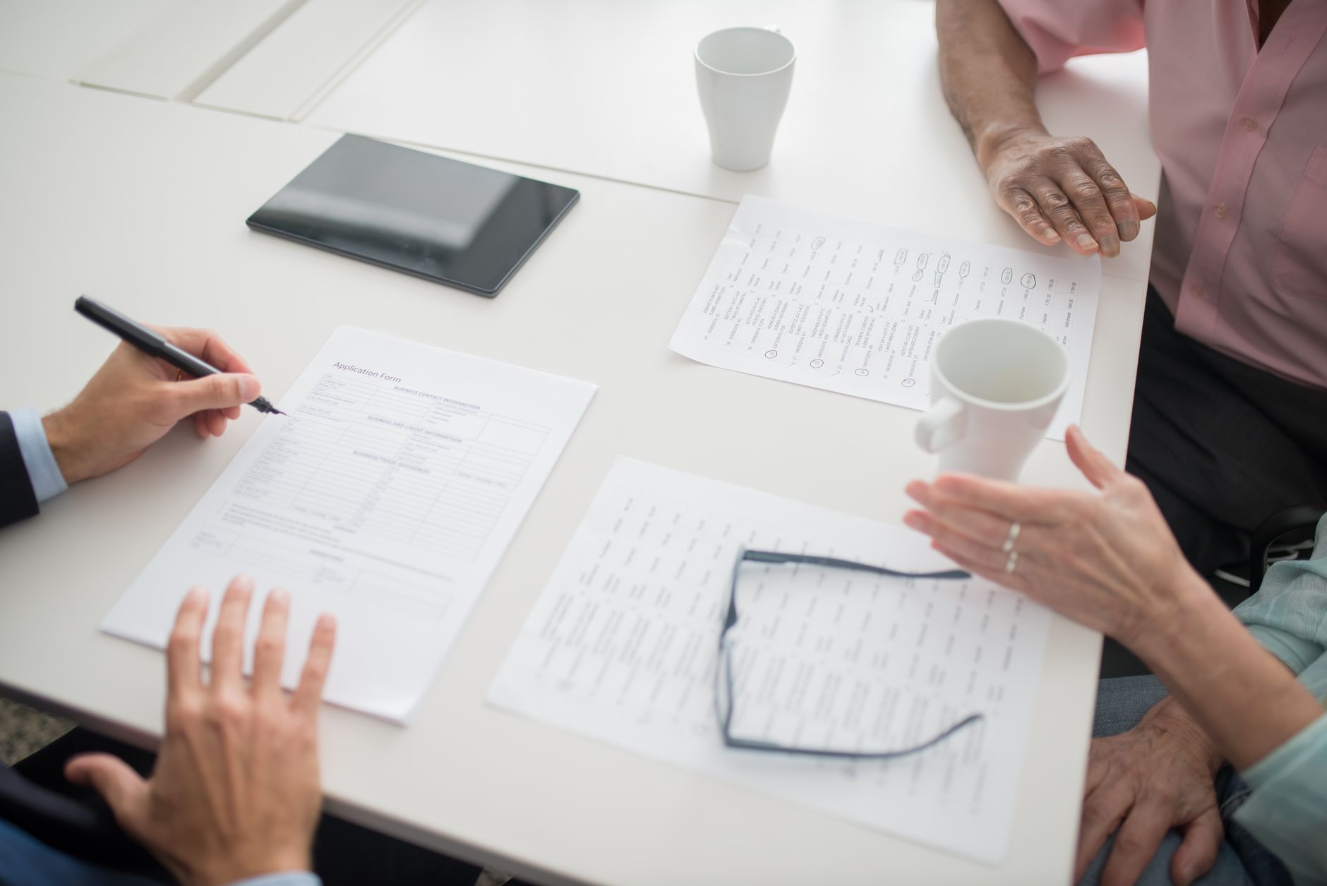 Health insurance enrollment paperwork spread across a desk