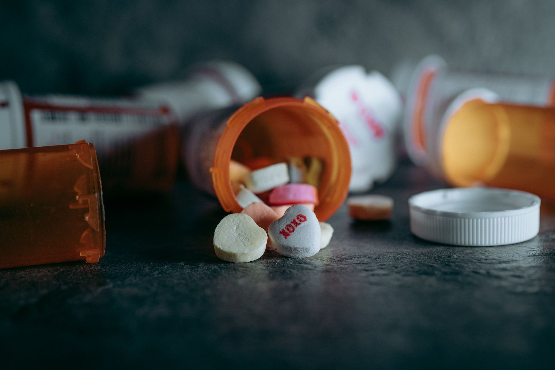 Prescription pill bottles on a pharmacy counter