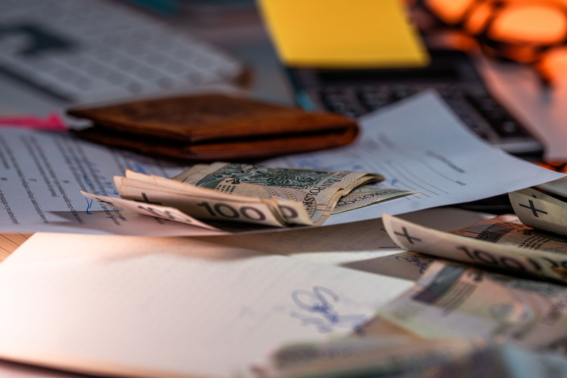 Retirement plan statement and paperwork on a desk beside a calculator