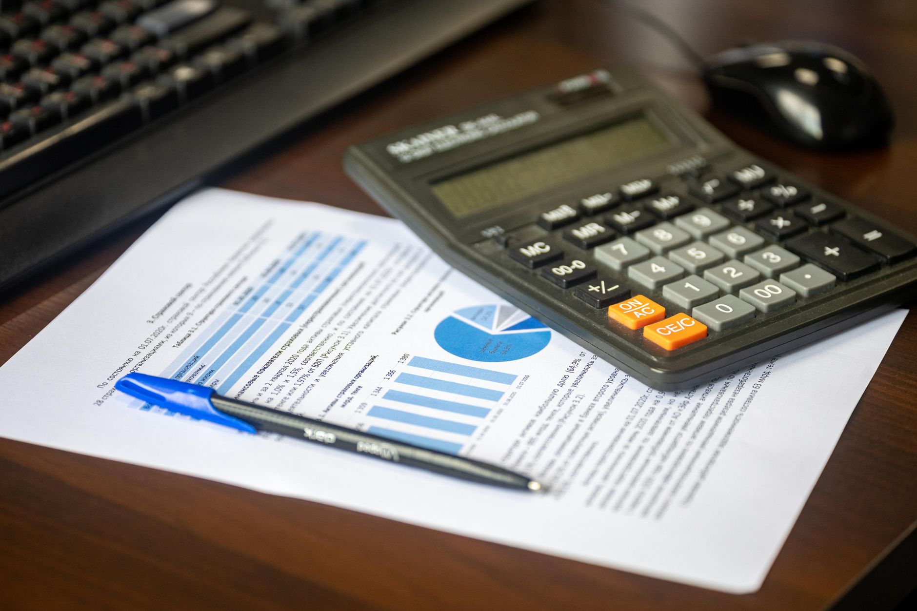 Retirement planning paperwork and a calculator on a desk