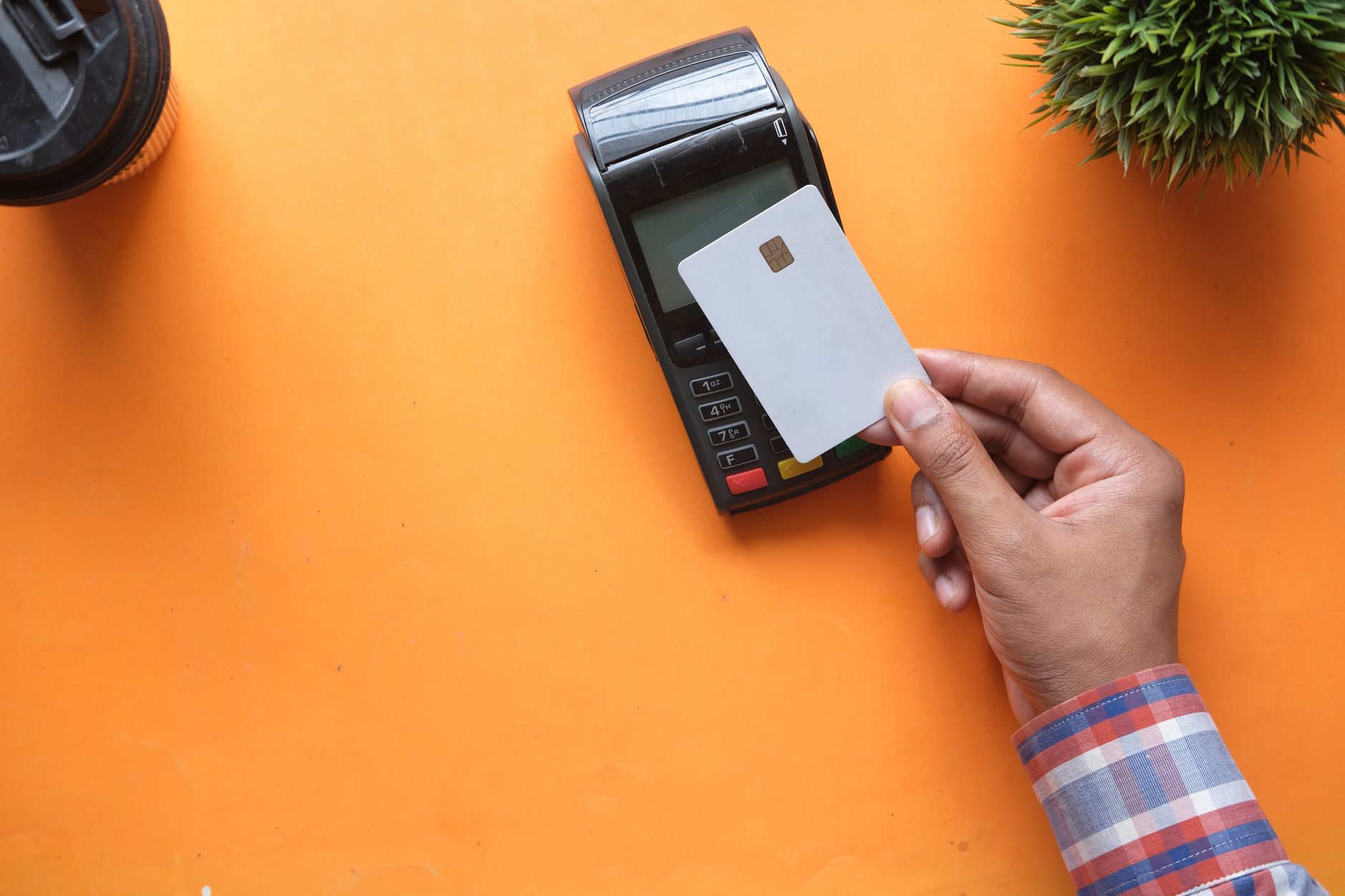 Chip card inserted into a payment terminal at a store counter