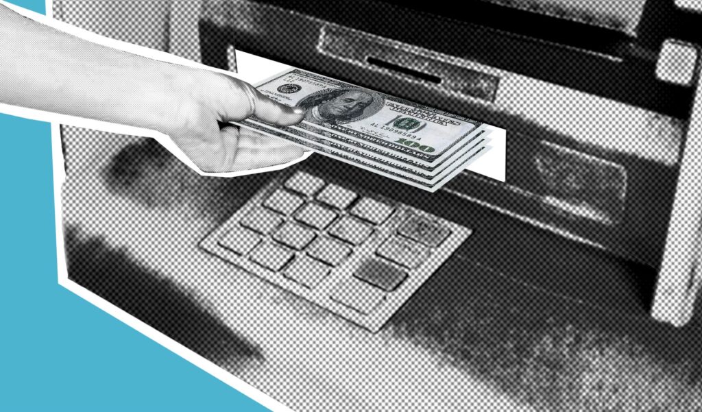 Person withdrawing cash from an ATM