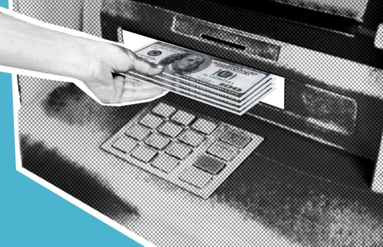Person withdrawing cash from an ATM