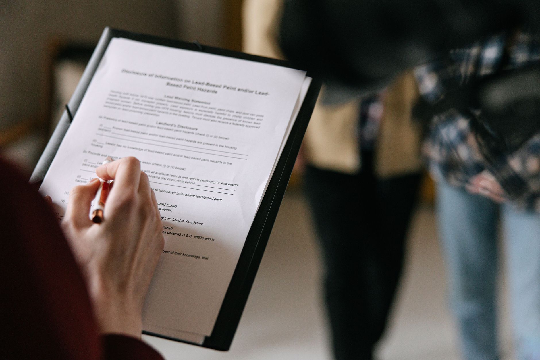 Person reviewing estate planning and bank documents at a desk